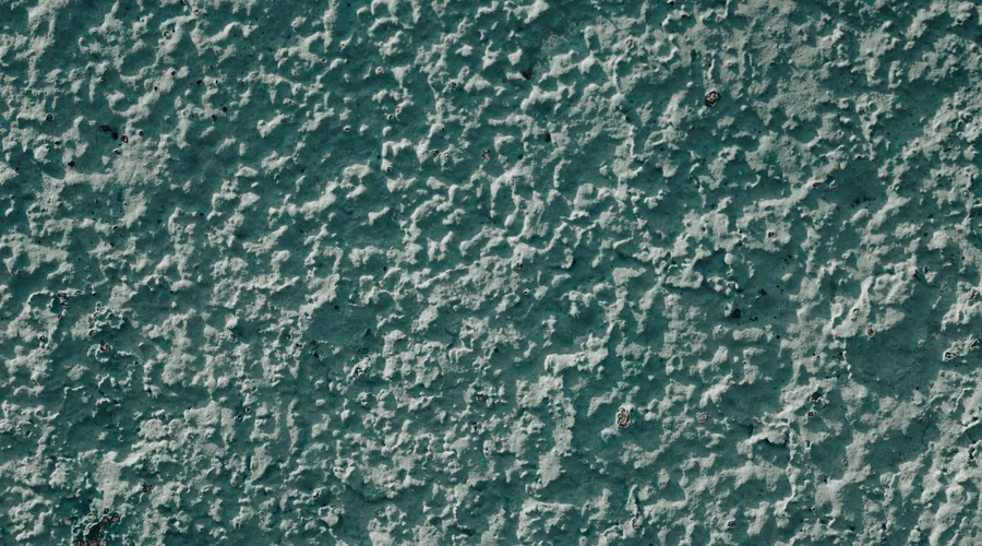 Satin Finish - Close-up of a rough textured blue wall surface