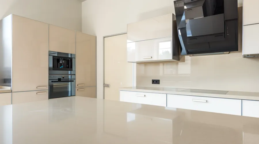 Head-to-Head: Which Primer Wins Where? - Sleek and spacious modern kitchen design featuring glossy cabinets and high-end appliances
