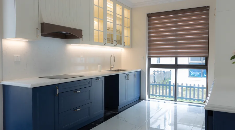 Quick Comparison - Bright modern kitchen featuring blue cabinetry