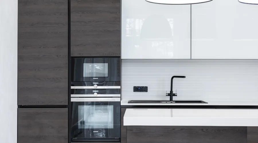 Which Primer Should You Choose? - Interior detail of modern kitchen with minimalist furniture contemporary appliances decorated with lamps hanging over counter