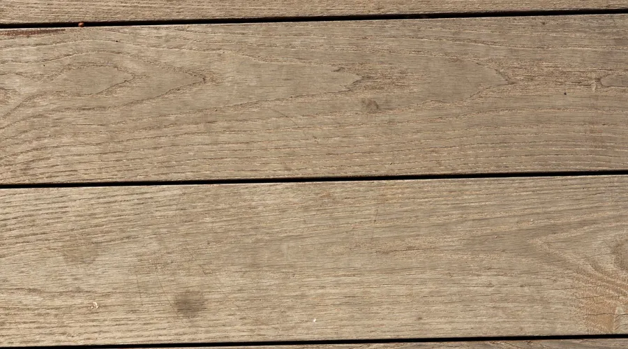 Head-to-Head: Appearance & Color - Close-up of rustic wooden planks forming a textured backdrop