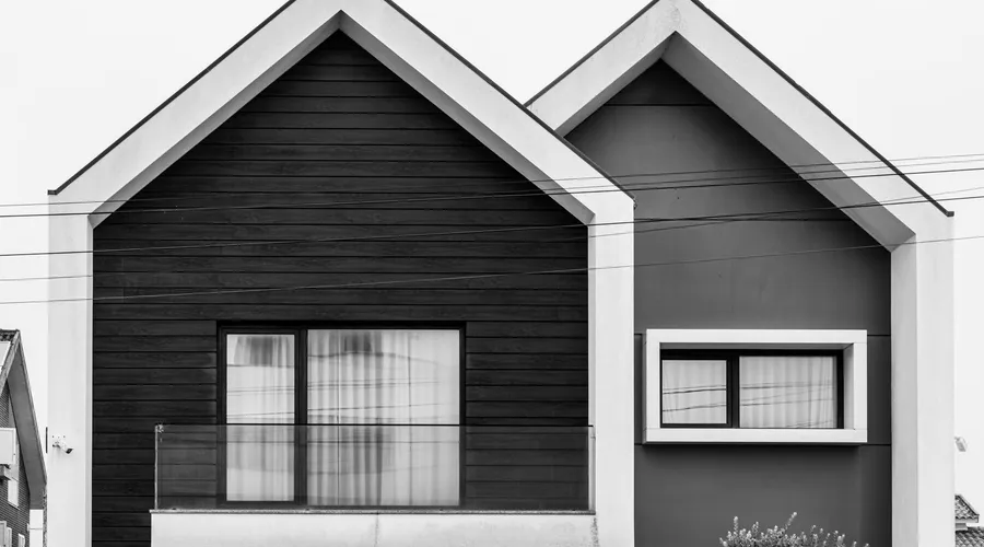 Head-to-Head - Striking minimalist facade of a modern house with geometric patterns in black and white